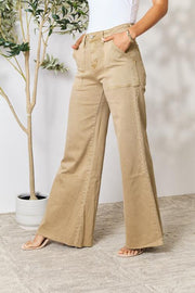 An image showcasing a petite woman wearing wide leg jeans, emphasizing their flattering silhouette and tailored fit